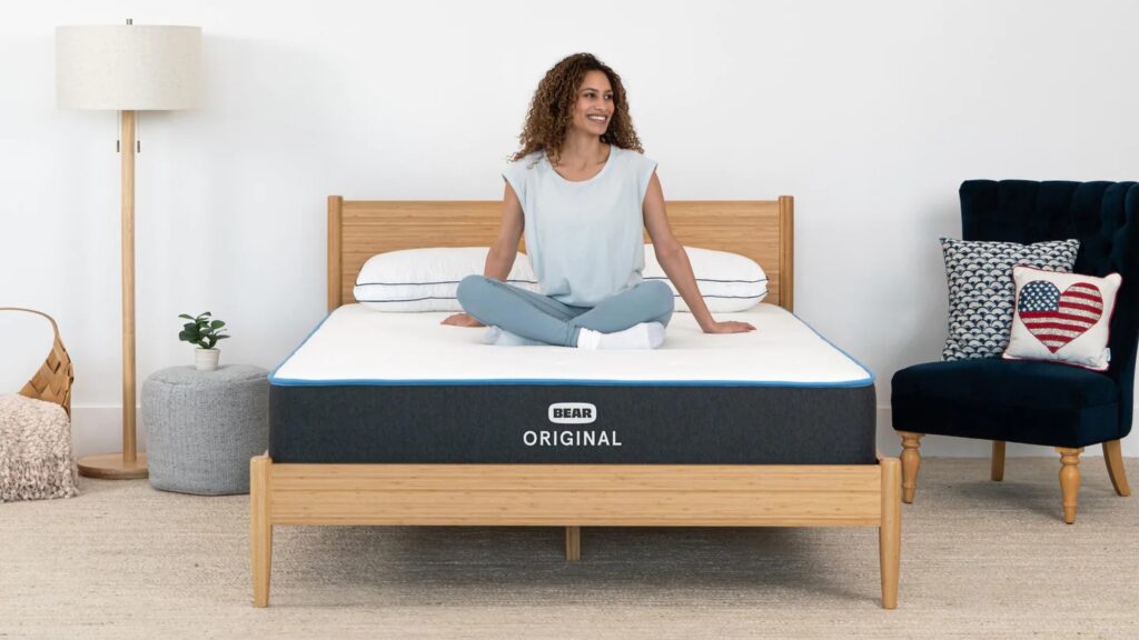 Woman sitting on Bear Original mattress
